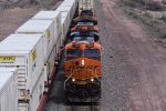 BNSF 7268, 1105, and 8866 highball under bridge in Petrified Forest NP